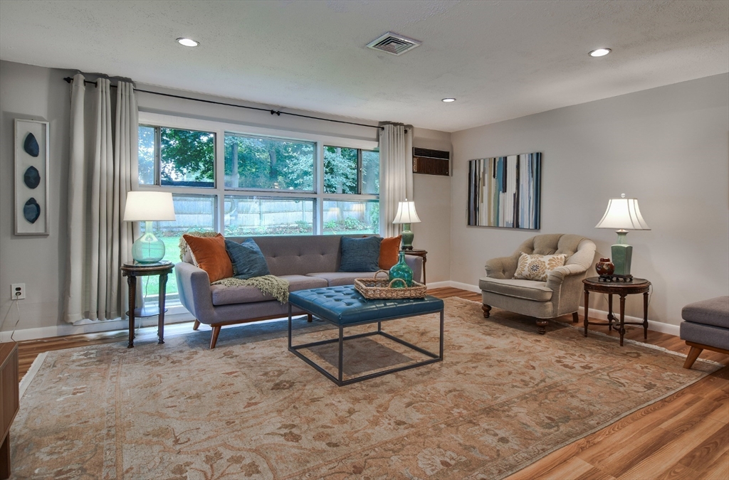 52 Lohnes Road Framingham, MA 01701 - Photo 10 of 34 a living room with furniture and a large window
