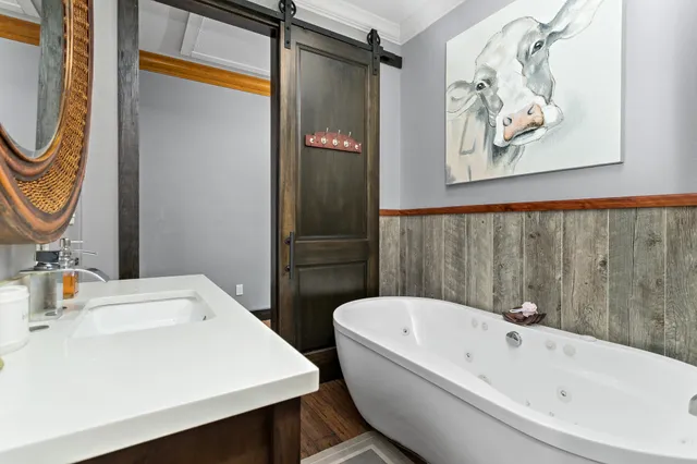 a bathroom with a bathtub a sink and a shower