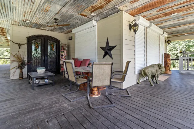 a view of a chairs in wooden deck