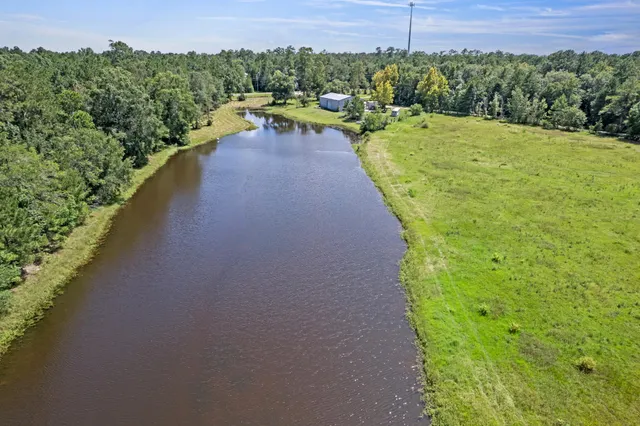a view of a swimming pool with a yard