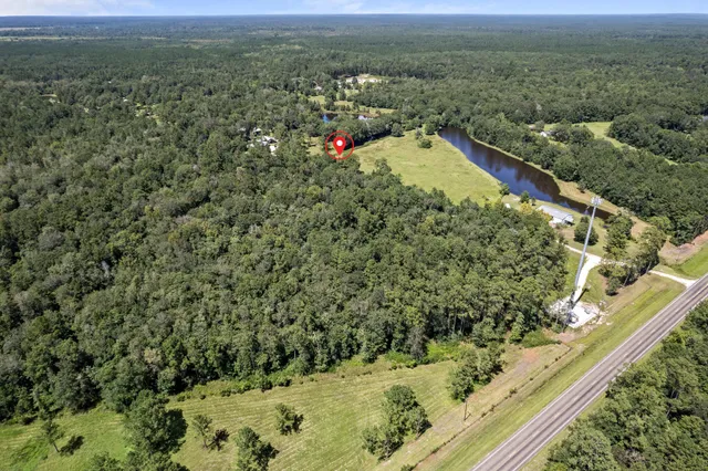 an aerial view of a residential houses with swimming pool