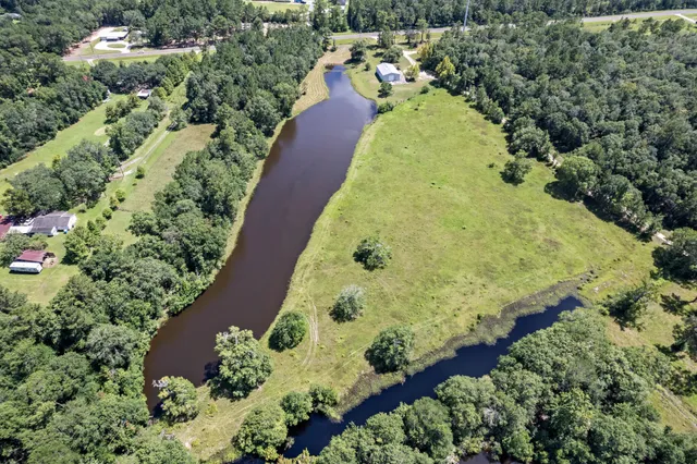 an aerial view of a house with outdoor space and street view