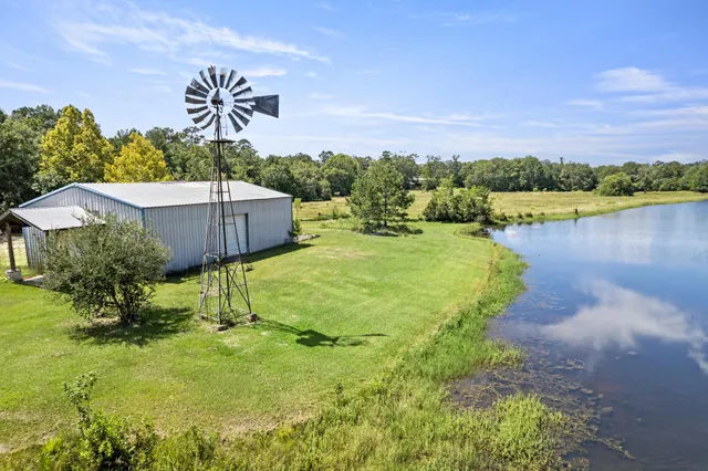 a view of a lake with a house in the background