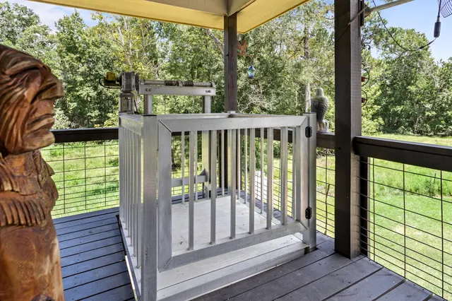 a view of a wooden balcony with a swing