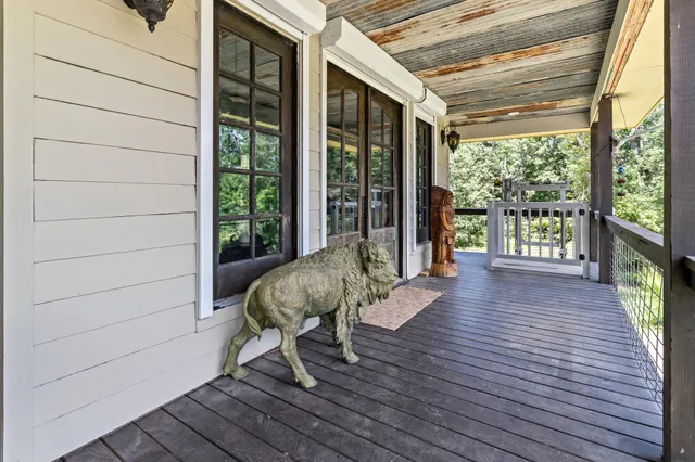 a living room filled with furniture window and hardwood floor
