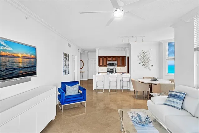 a kitchen with stainless steel appliances kitchen island granite countertop a sink and cabinets