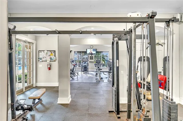 a view of a livingroom with workspace and a window