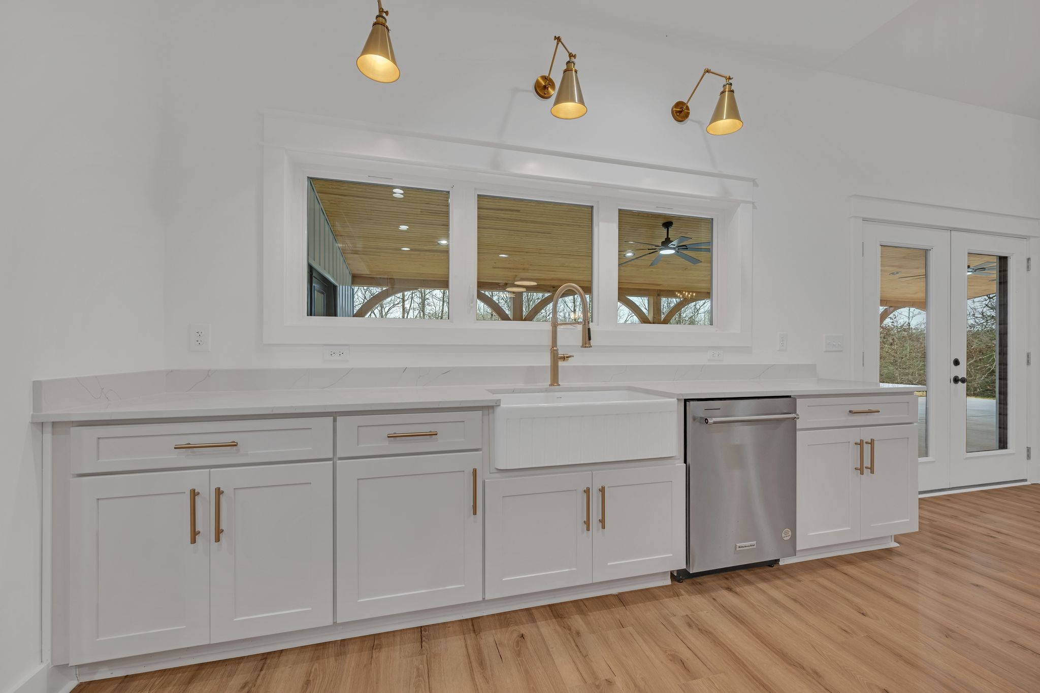 2024 Trace Creek Road Centerville, TN 37033 - Photo 19 of 51 a view of cabinets a sink and dishwasher with wooden floor
