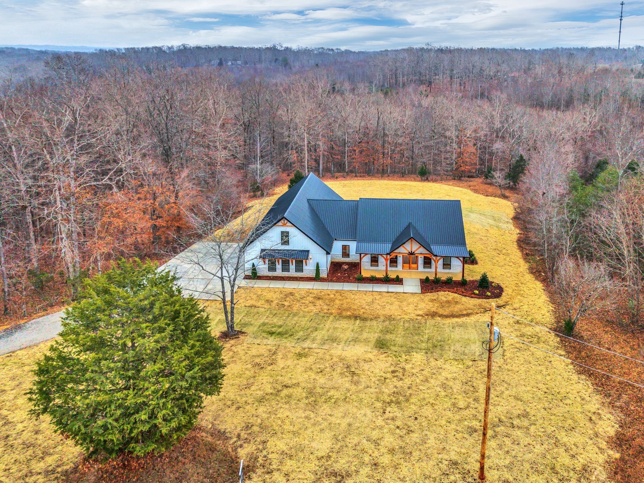 2024 Trace Creek Road Centerville, TN 37033 - Photo 2 of 51 a view of a house with a yard and sitting area