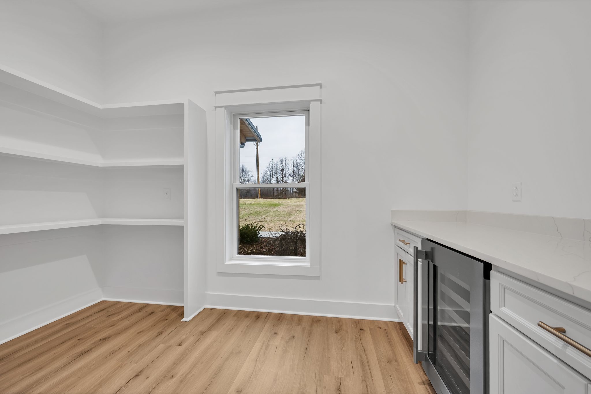 2024 Trace Creek Road Centerville, TN 37033 - Photo 21 of 51 a view of an empty room with wooden floor and a window