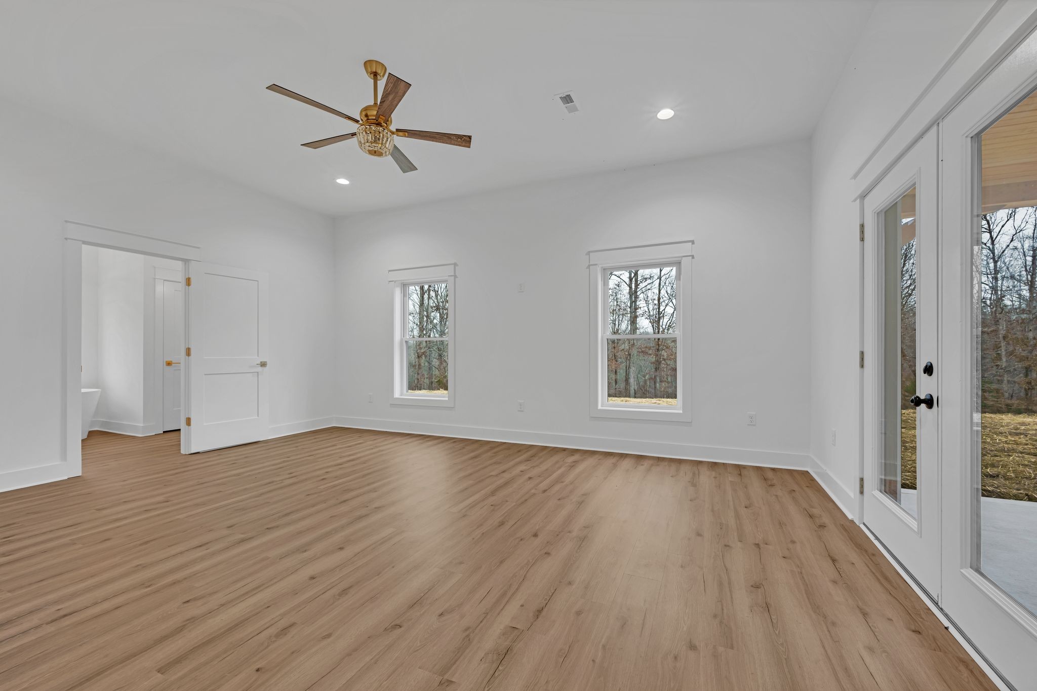 2024 Trace Creek Road Centerville, TN 37033 - Photo 26 of 51 an empty room with wooden floor and windows