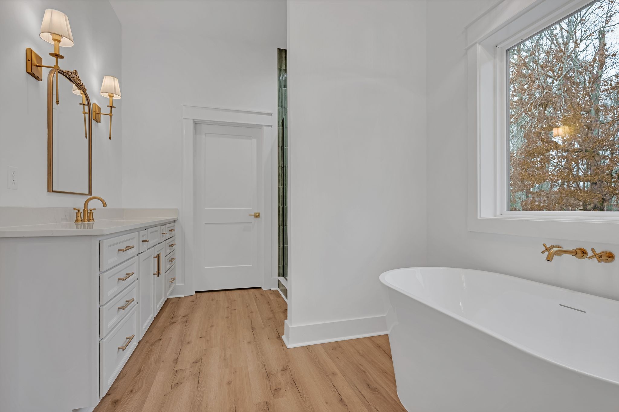 2024 Trace Creek Road Centerville, TN 37033 - Photo 31 of 51 a spacious bathroom with a tub sink and mirror