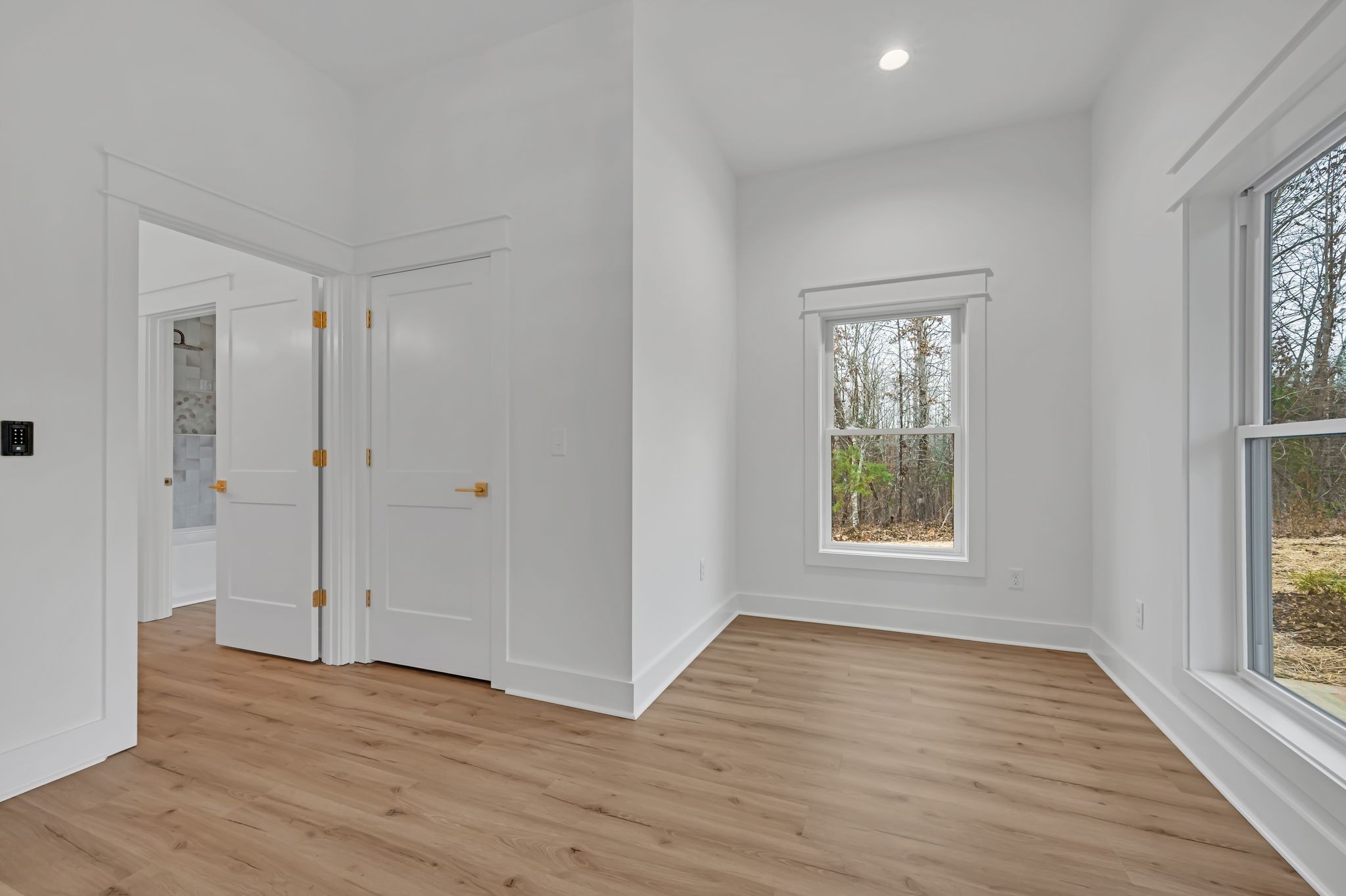 2024 Trace Creek Road Centerville, TN 37033 - Photo 35 of 51 a view of an empty room with wooden floor and a window