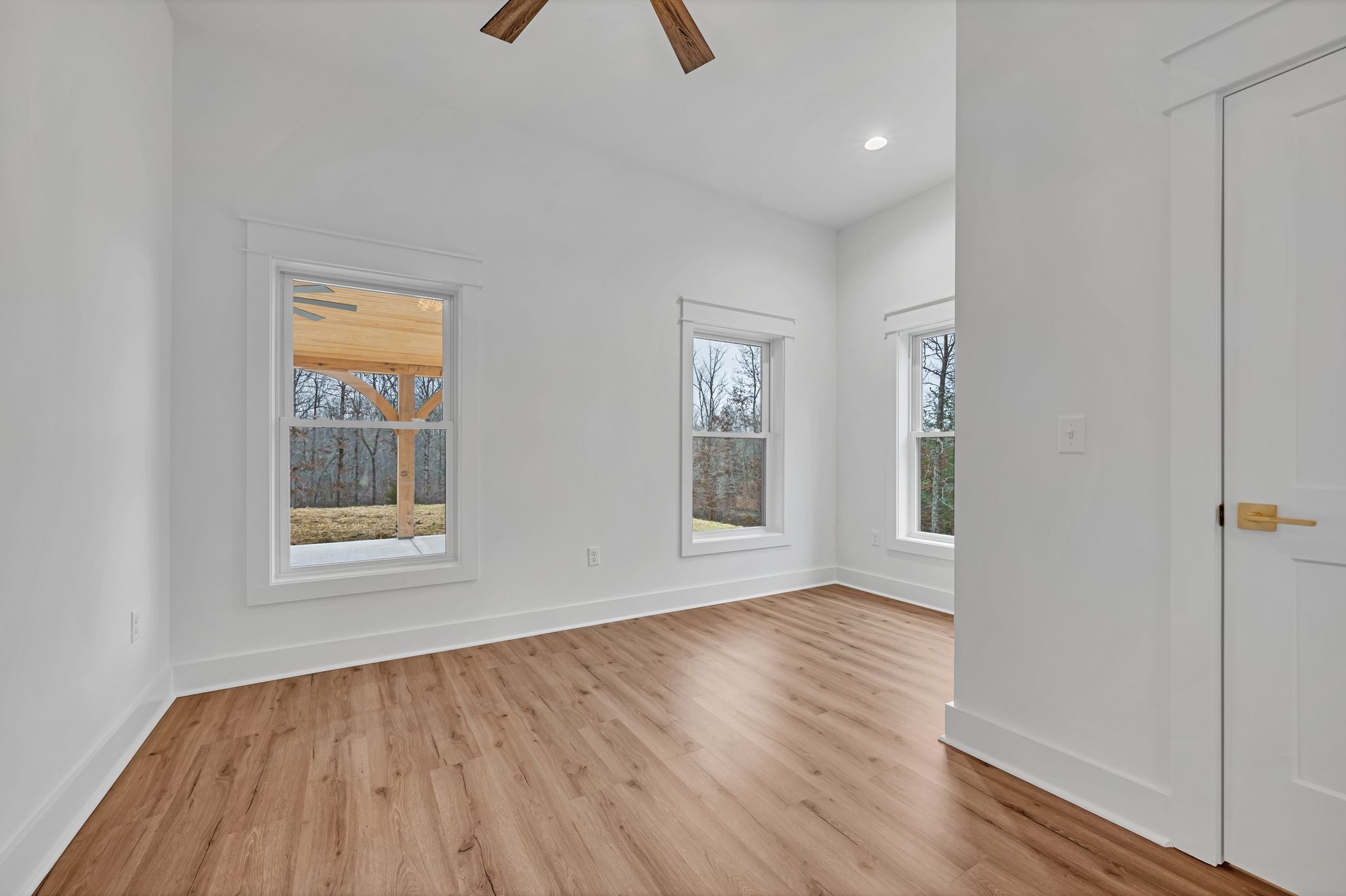 2024 Trace Creek Road Centerville, TN 37033 - Photo 39 of 51 an empty room with wooden floor and windows