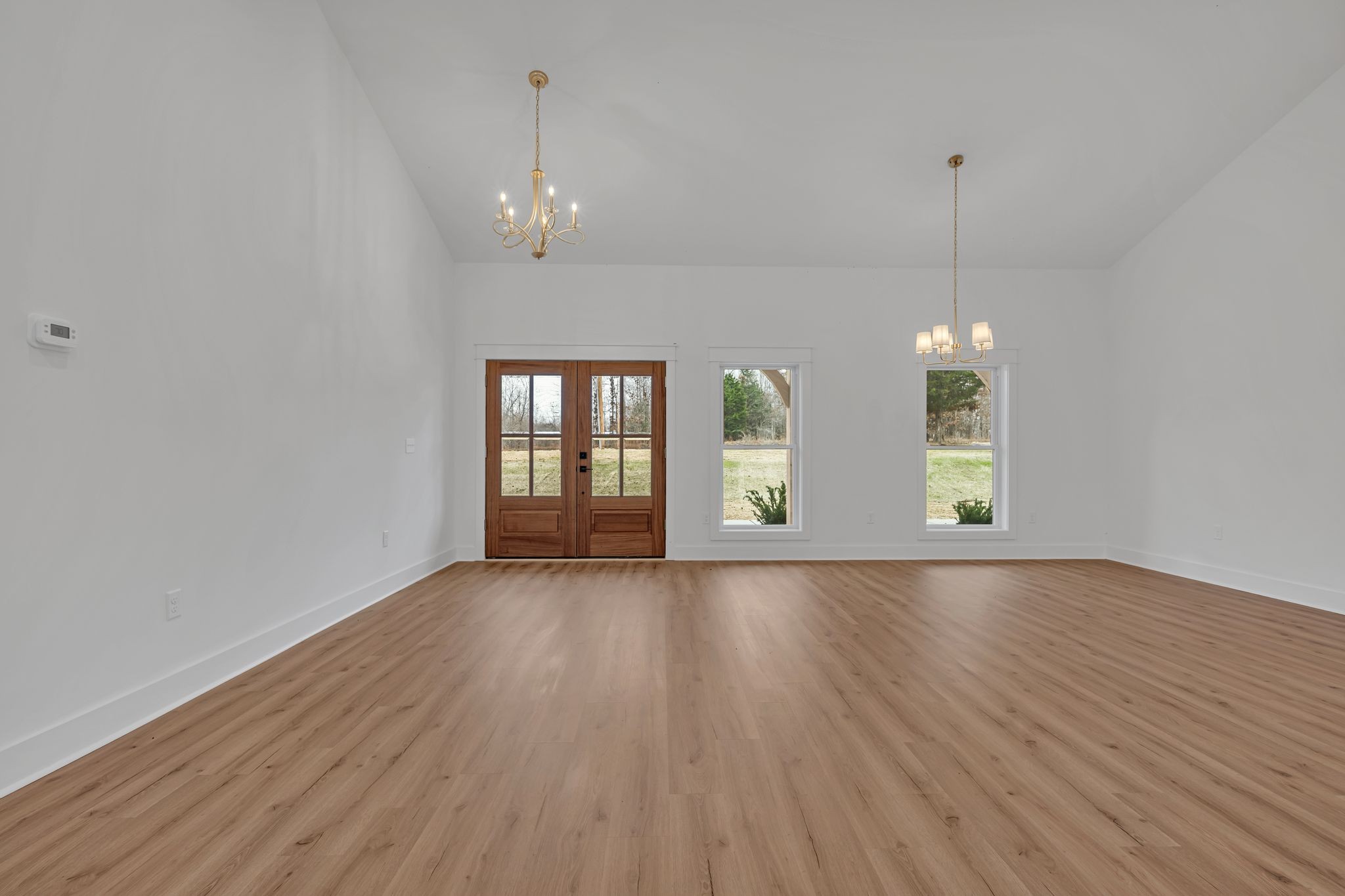 2024 Trace Creek Road Centerville, TN 37033 - Photo 8 of 51 an empty room with wooden floor and windows