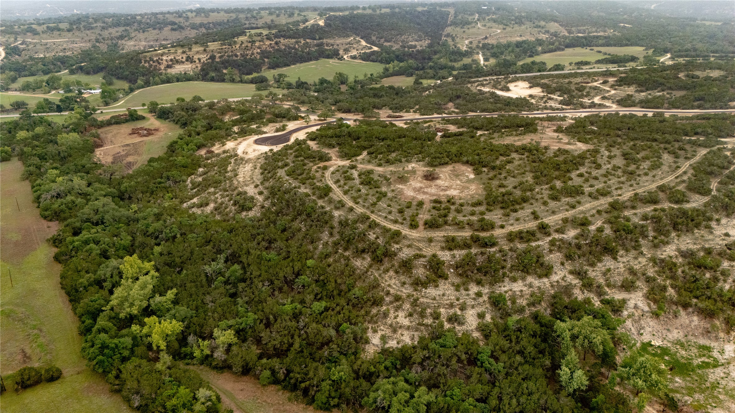 Lot 24 Ranch Road 165 Dripping Springs, TX 78620 - Photo 6 of 13 an aerial view of residential house with parking space