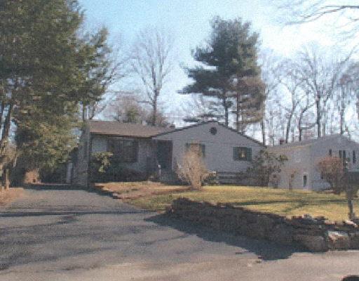 17 Woodhill Road Trumbull, CT 06611 - Photo 1 of 1 a view of a house with a yard covered with snow