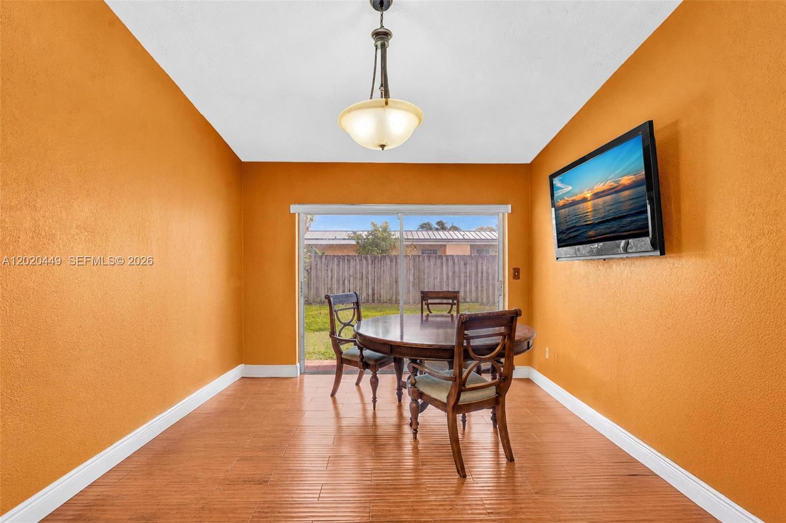 11061 Southwest 163rd Street Miami, FL 33157 - Photo 8 of 42 a dining room with furniture and wooden floor