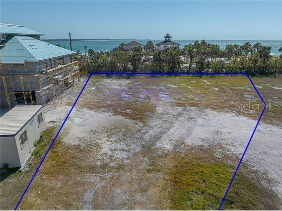 870 Grande Pass Way Boca Grande, FL 33921 - Photo 11 of 12 a view of a lake with a mountain