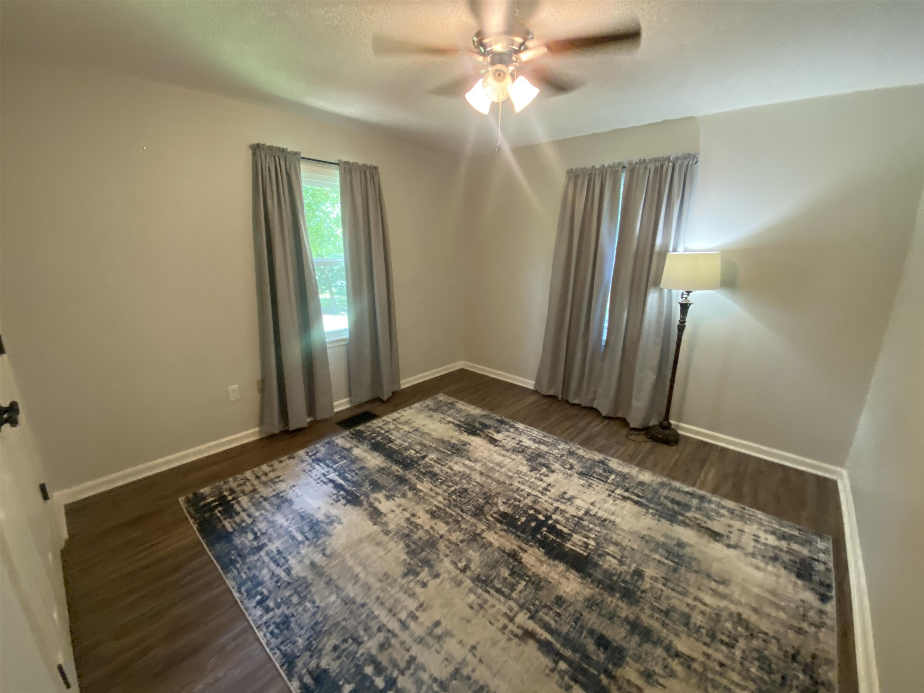 6546 Old Tipton Road Millington, TN 38053 - Photo 15 of 23 Empty room with ceiling fan and hardwood / wood-style floors