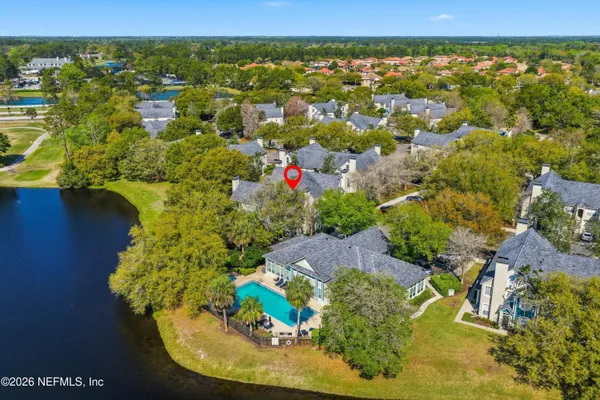 an aerial view of residential houses with outdoor space