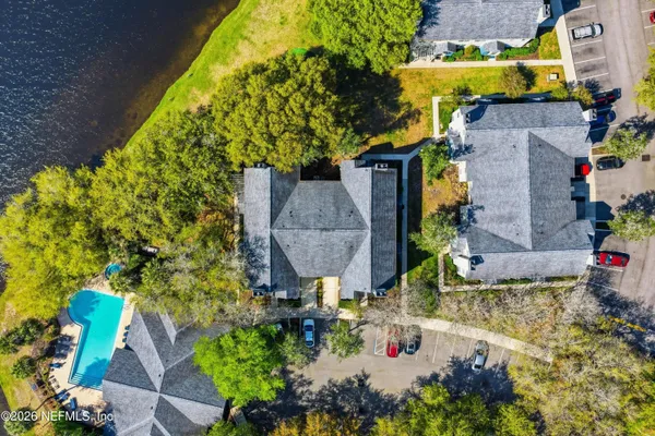 a aerial view of a house with a yard and garden