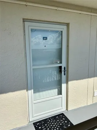 a bathroom with a glass shower door