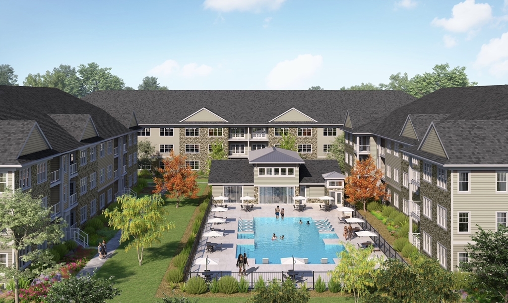 180 Old Post Road, Unit 206 Sharon, MA 02067 - Photo 2 of 7 an aerial view of multiple houses with a yard