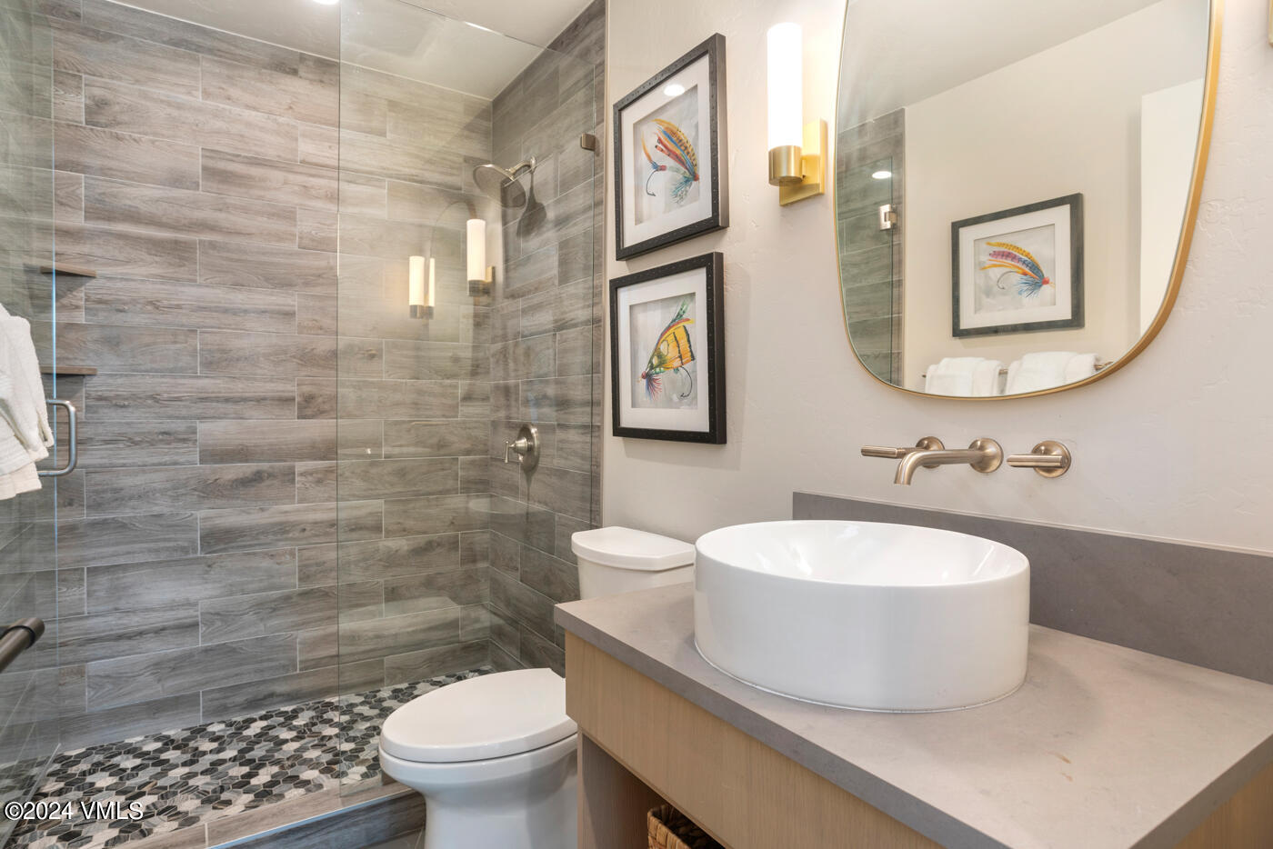 92 Knudson Ranch Road Edwards, CO 81632 - Photo 16 of 37 a bathroom with a sink a toilet and mirror