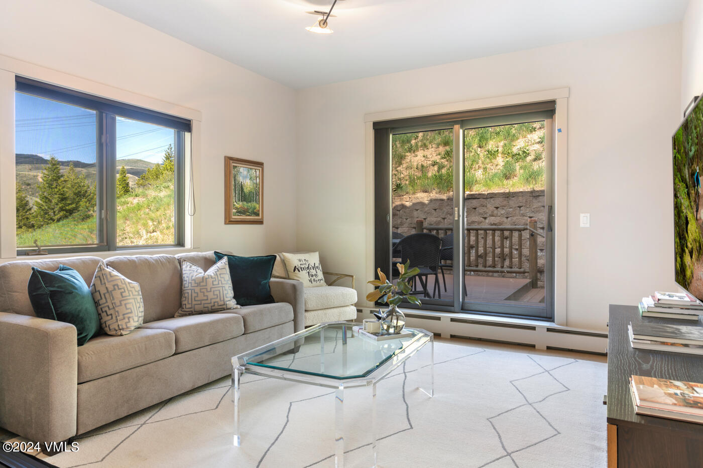 92 Knudson Ranch Road Edwards, CO 81632 - Photo 17 of 37 a living room with furniture and a large window