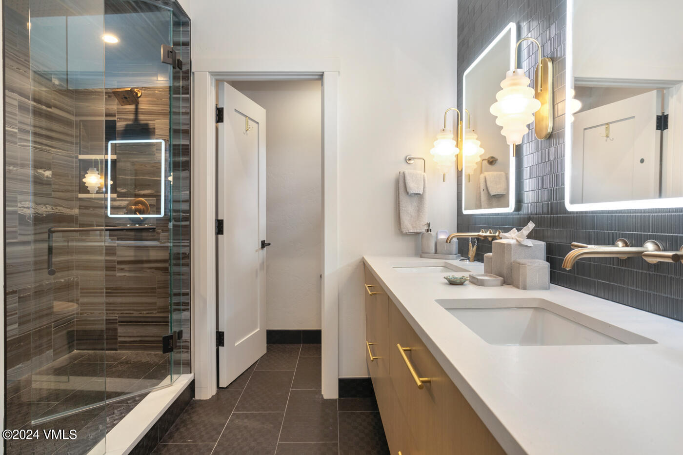 92 Knudson Ranch Road Edwards, CO 81632 - Photo 22 of 37 a bathroom with a sink a shower and a mirror