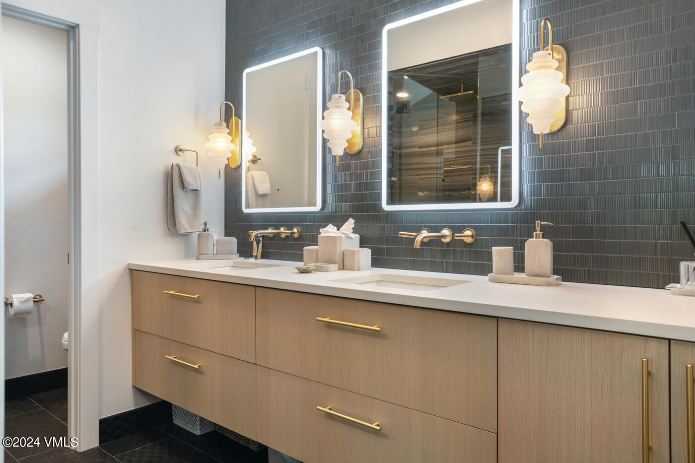 92 Knudson Ranch Road Edwards, CO 81632 - Photo 23 of 37 a bathroom with a sink and a mirror