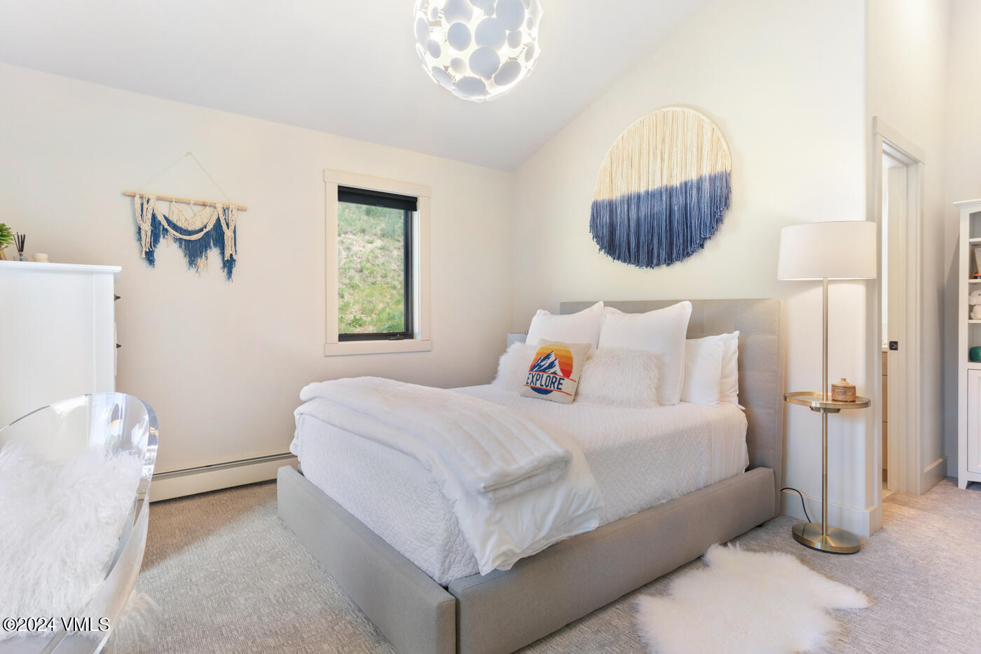 92 Knudson Ranch Road Edwards, CO 81632 - Photo 25 of 37 a bedroom with a bed and a mirror