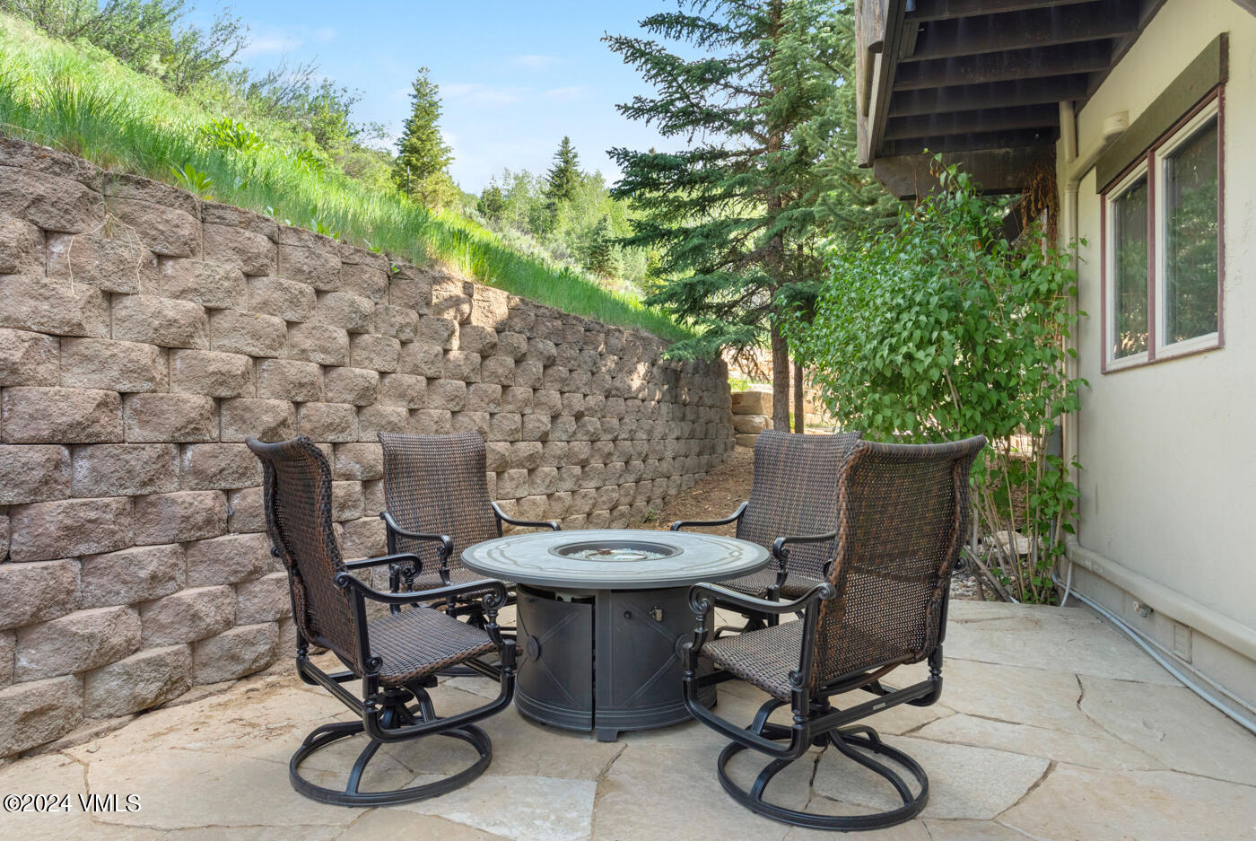 92 Knudson Ranch Road Edwards, CO 81632 - Photo 30 of 37 a view of a backyard with table and chairs and potted plants