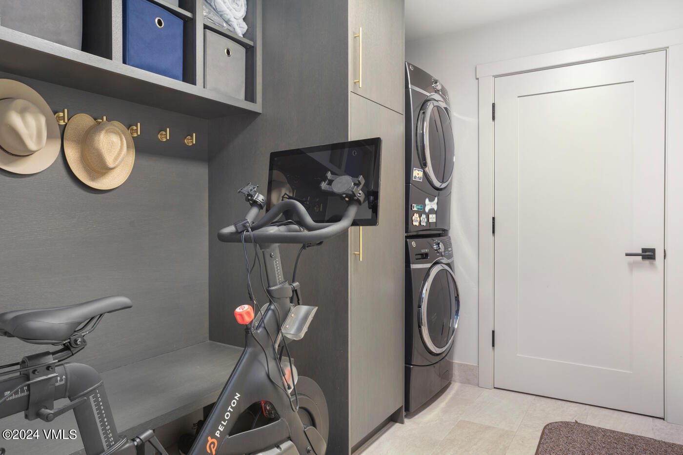 92 Knudson Ranch Road Edwards, CO 81632 - Photo 31 of 37 a room with a washing machine and cabinets