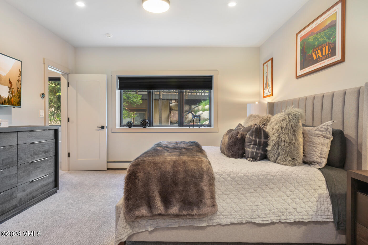 92 Knudson Ranch Road Edwards, CO 81632 - Photo 32 of 37 a bedroom with a large bed and a window