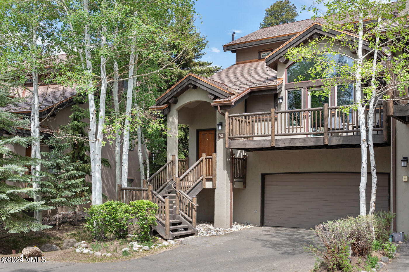 92 Knudson Ranch Road Edwards, CO 81632 - Photo 37 of 37 a front view of a house with a yard garage and outdoor seating