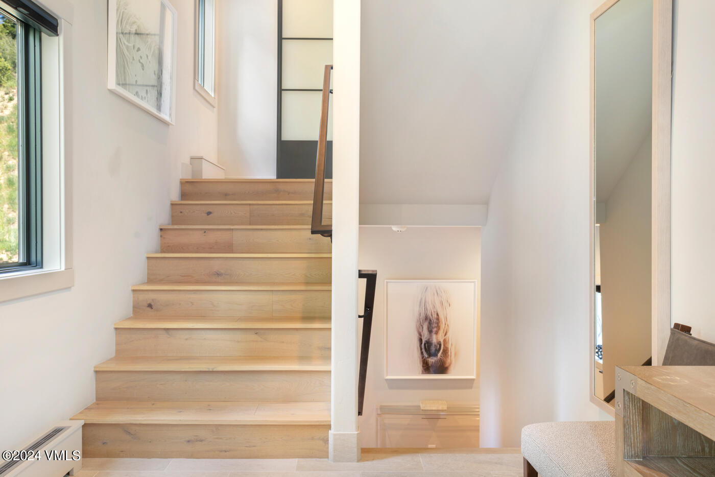 92 Knudson Ranch Road Edwards, CO 81632 - Photo 4 of 37 a view of staircase with white walls and windows