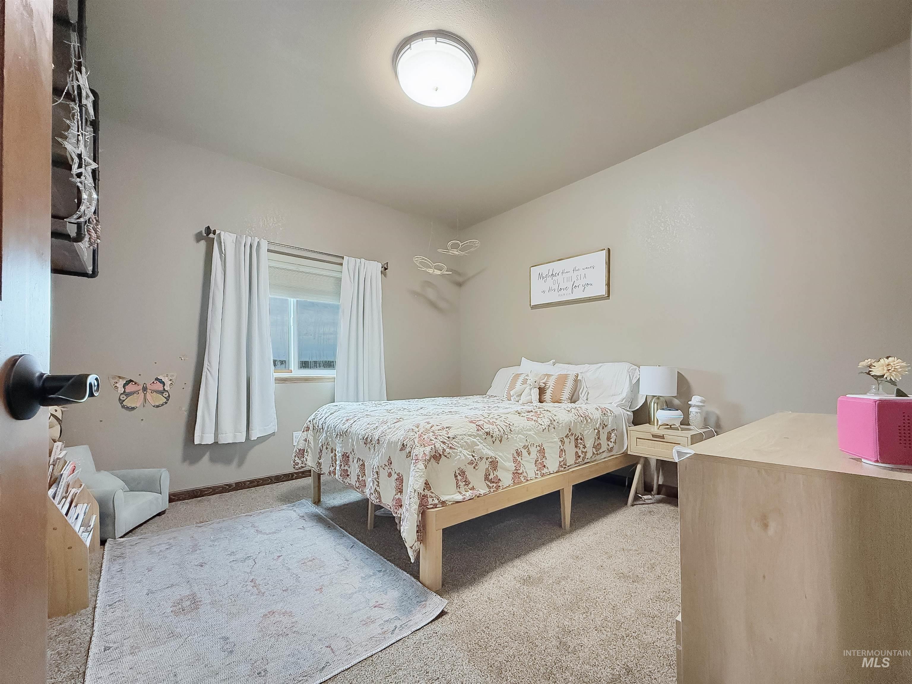 1030 Tempest Lane Viola, ID 83872 - Photo 13 of 37 Bedroom featuring carpet flooring