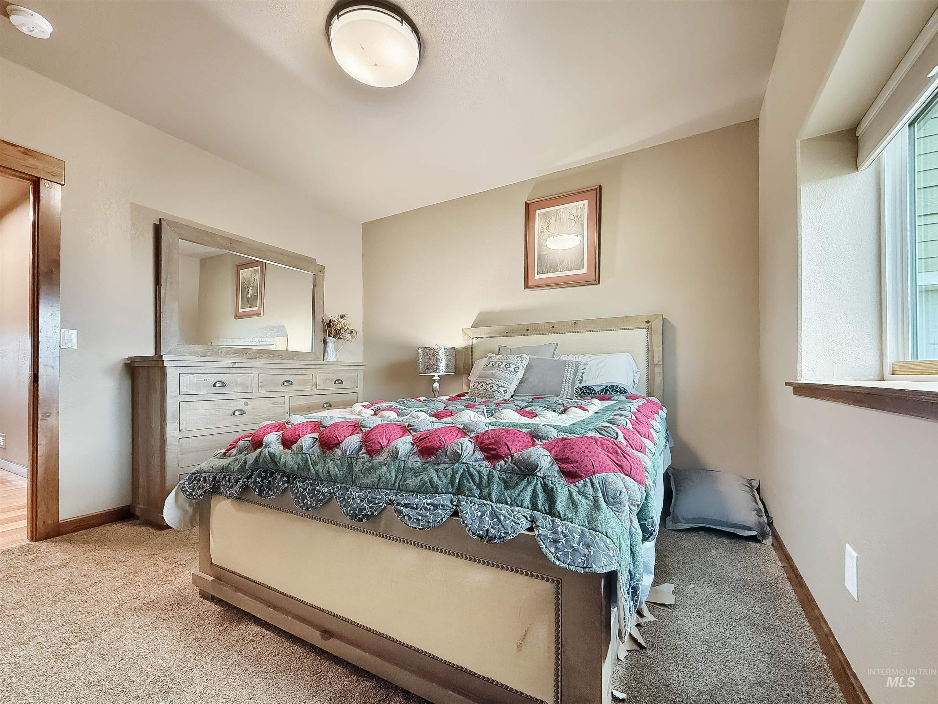 1030 Tempest Lane Viola, ID 83872 - Photo 17 of 37 Carpeted bedroom with baseboards