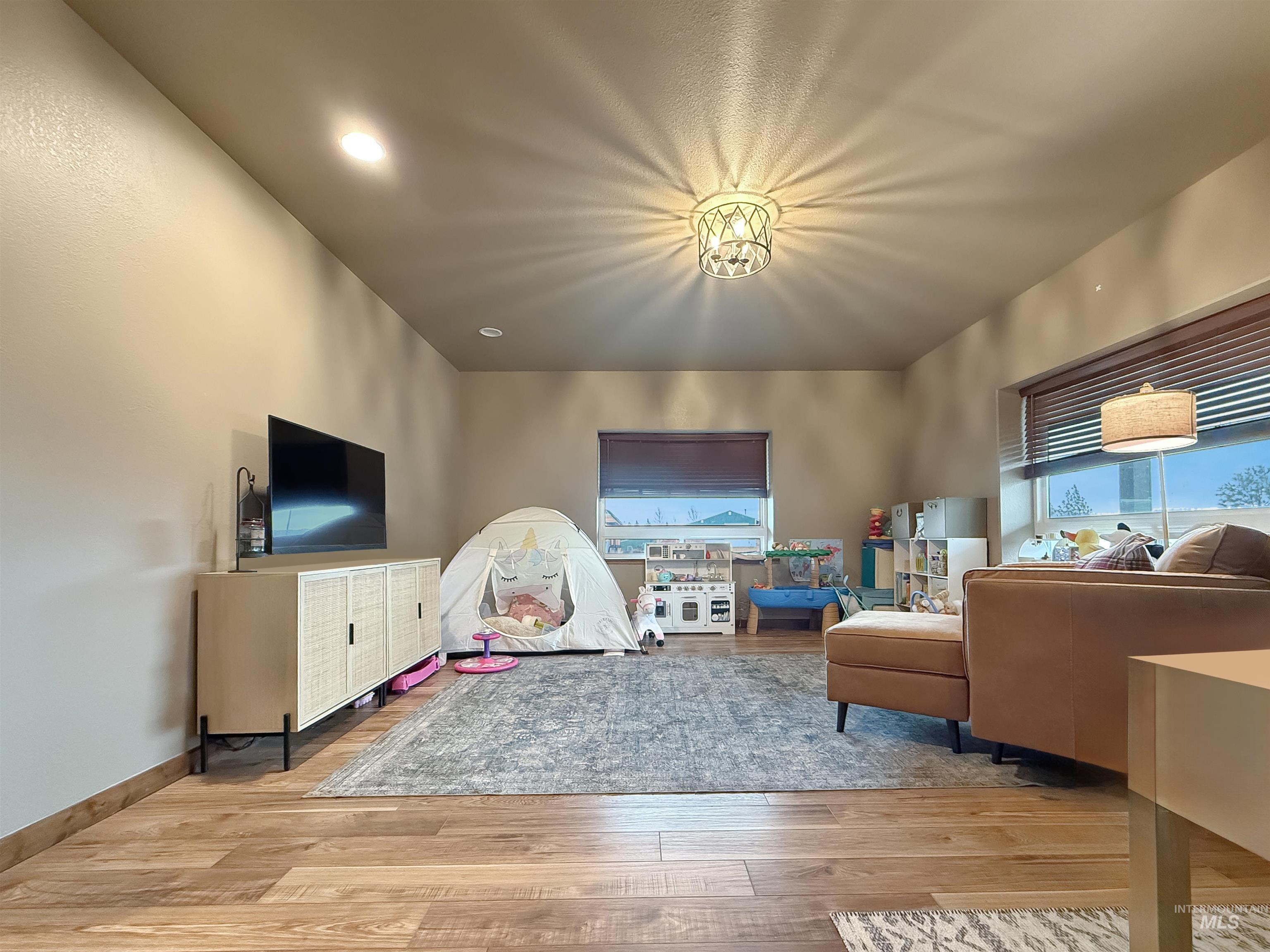 1030 Tempest Lane Viola, ID 83872 - Photo 3 of 37 Playroom with light wood-type flooring and baseboards