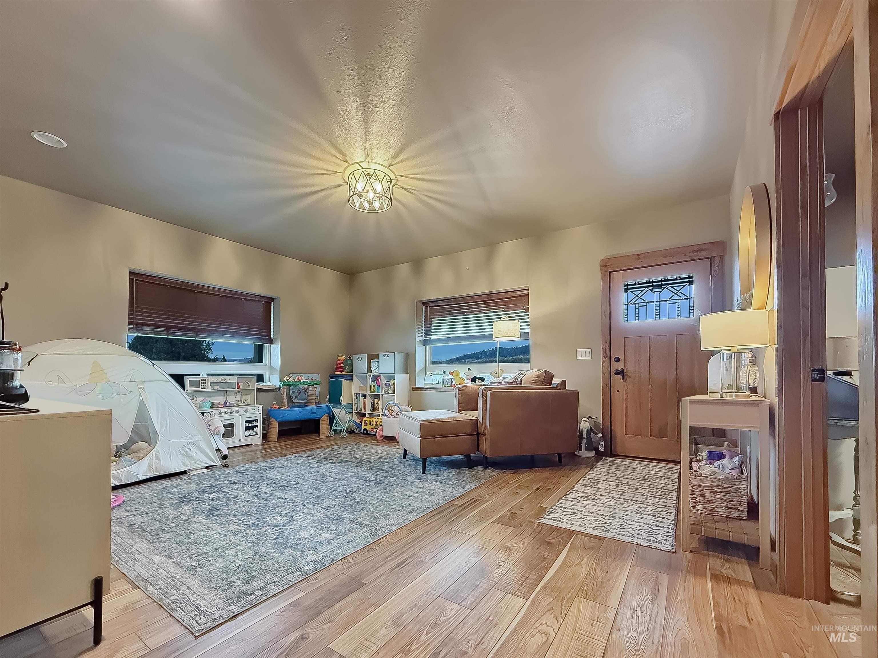 1030 Tempest Lane Viola, ID 83872 - Photo 4 of 37 Living room with light wood-style floors