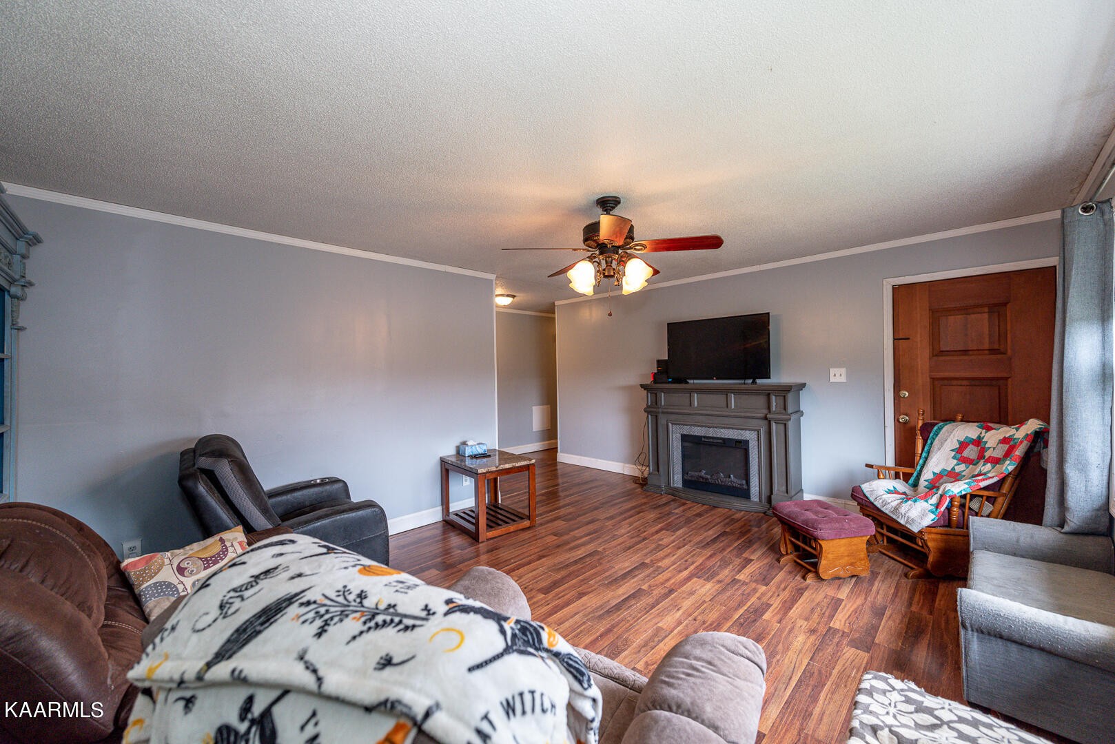 1399 Niles Ferry Road Greenback, TN 37742 - Photo 12 of 28 a bedroom with furniture a fireplace and a flat screen tv