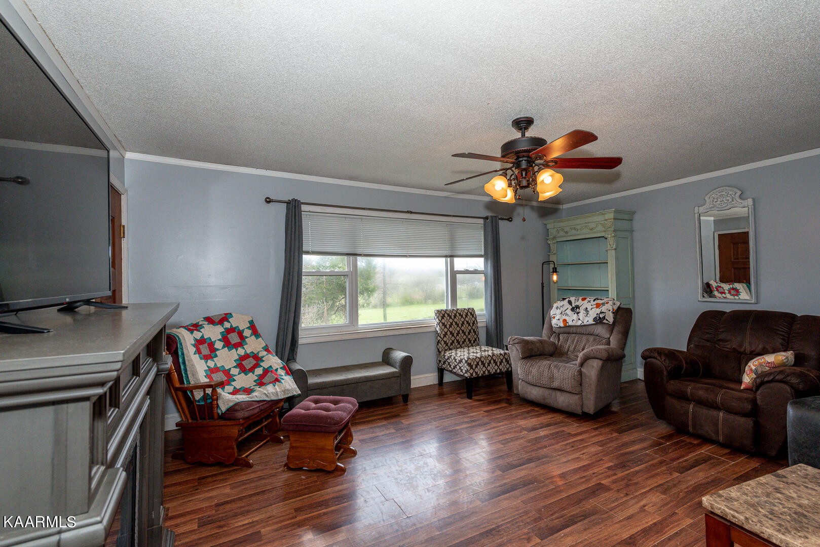 1399 Niles Ferry Road Greenback, TN 37742 - Photo 13 of 28 a living room with furniture and a chandelier