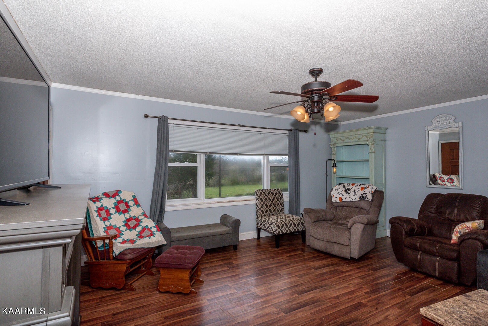 1399 Niles Ferry Road Greenback, TN 37742 - Photo 14 of 28 a living room with furniture and a chandelier