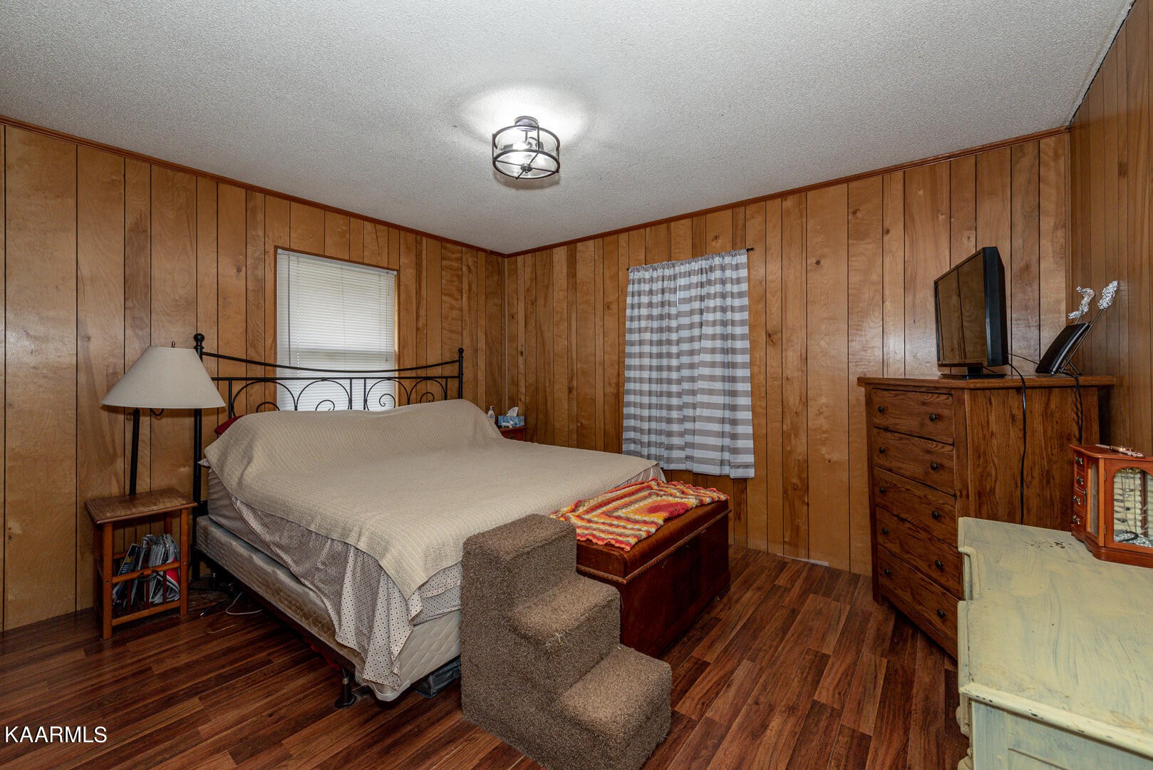 1399 Niles Ferry Road Greenback, TN 37742 - Photo 16 of 28 a bedroom with bed and wooden floor