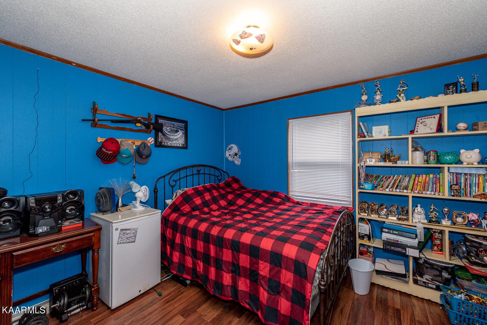 1399 Niles Ferry Road Greenback, TN 37742 - Photo 18 of 28 a bedroom with bed and a bookshelf