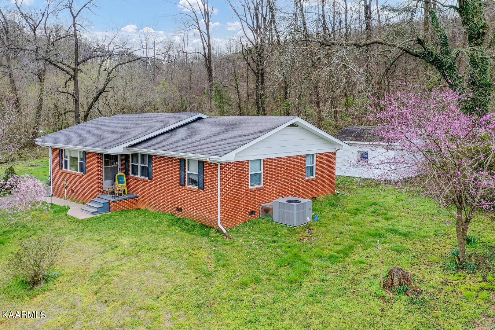 1399 Niles Ferry Road Greenback, TN 37742 - Photo 2 of 28 a aerial view of a house with yard and a garden