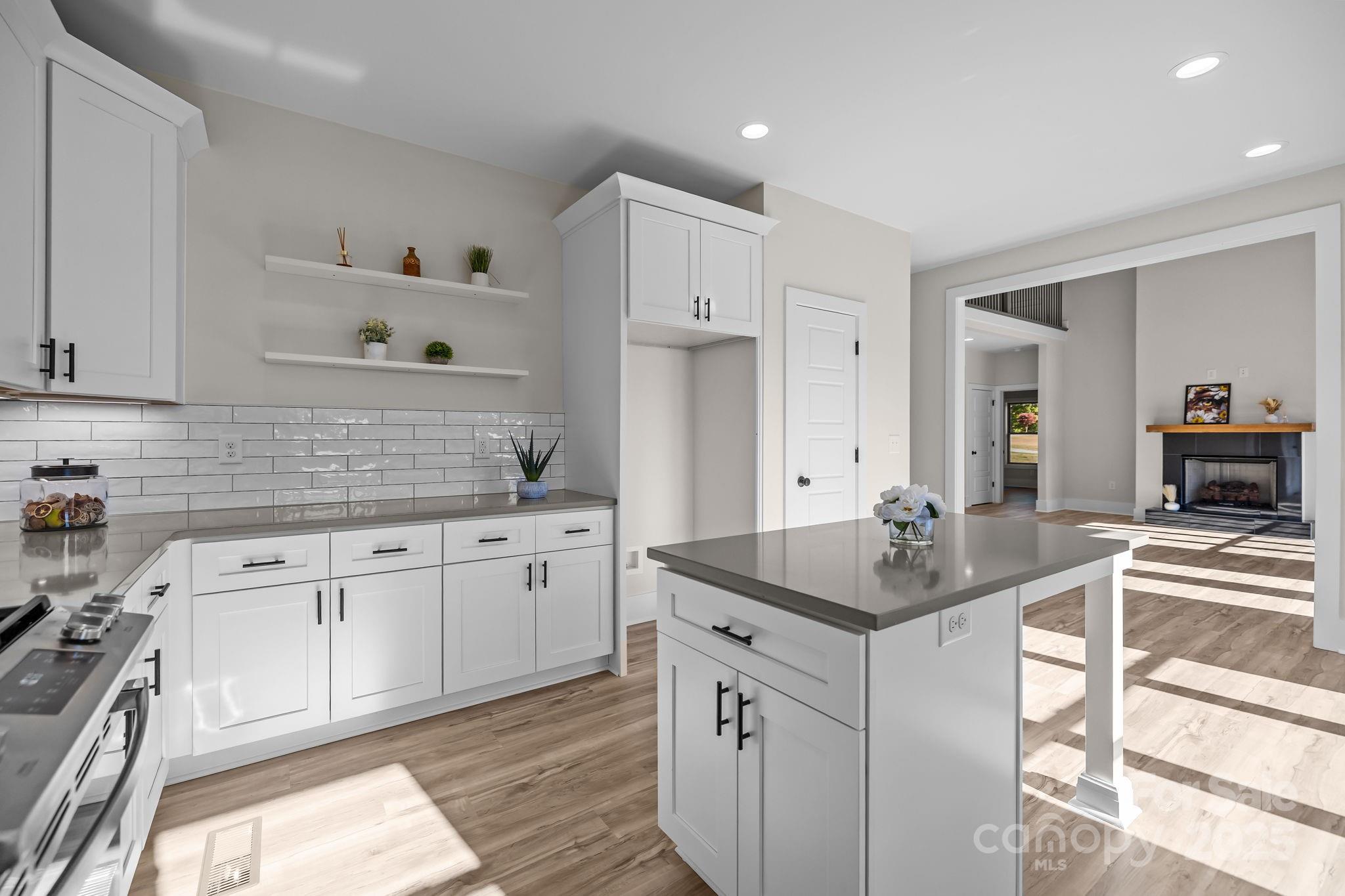 2003 Duntov Drive Monroe, NC 28110 - Photo 16 of 44 a kitchen with granite countertop a sink stove and cabinets