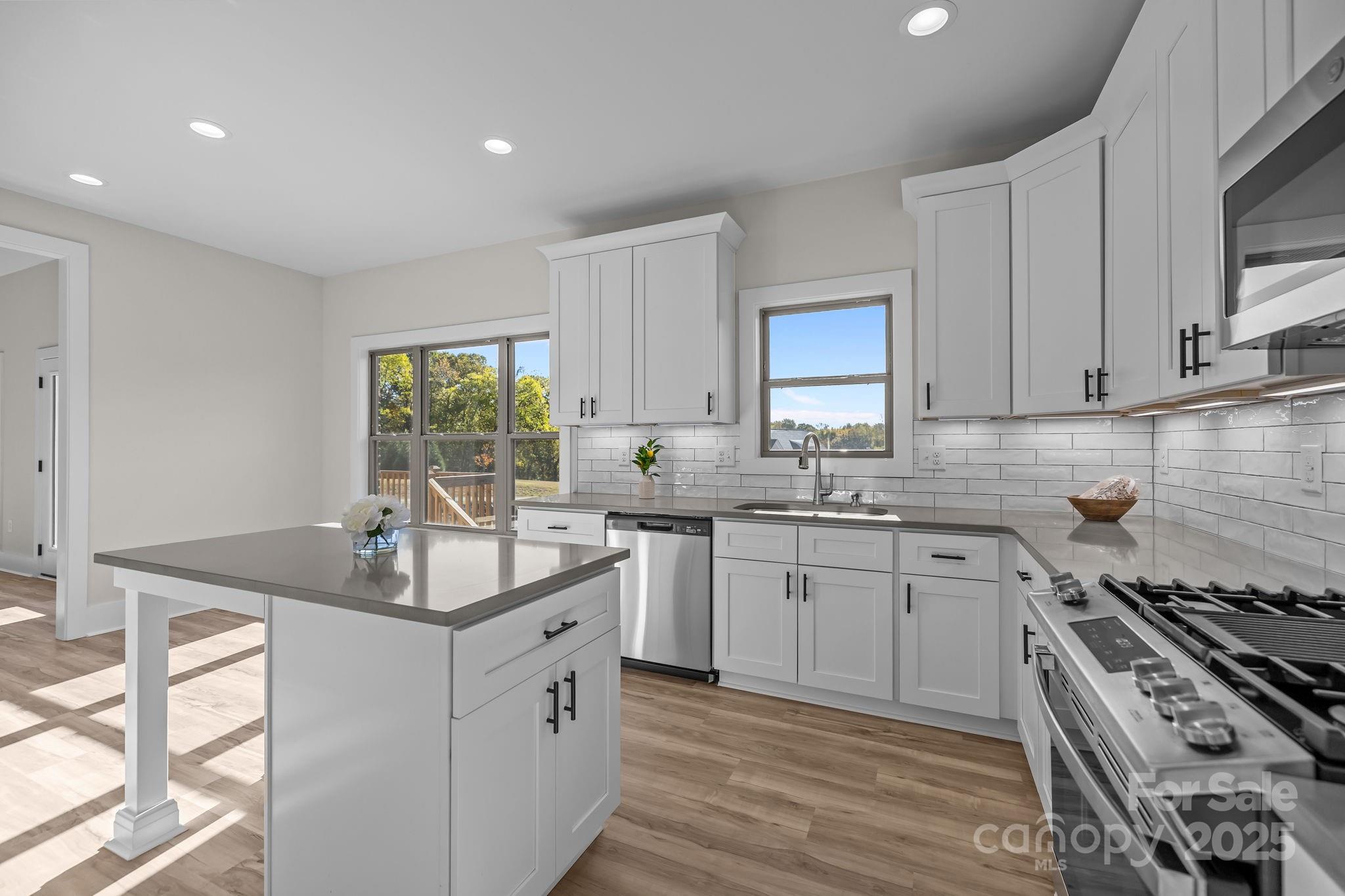 2003 Duntov Drive Monroe, NC 28110 - Photo 17 of 44 a kitchen with sink stove and cabinets